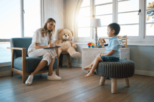 Therapist evaluating a child during an autism evaluation test