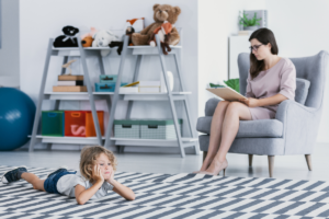 Healthcare professionals who can diagnose autism discussing evaluation process with family